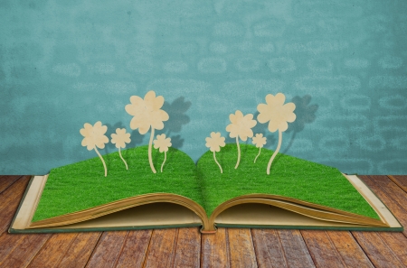 Paper cut of Four leaf clover on grass bookの写真素材
