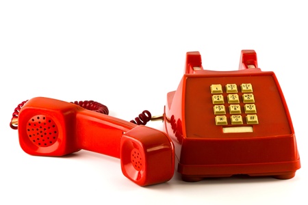 Old red phone isolated on white backgroundの写真素材