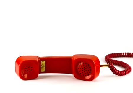 Old red phone isolated on white backgroundの写真素材
