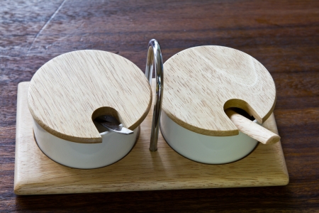 Salt and Pepper container on wood tableの写真素材