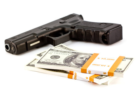 close up image of pistol and dollarの写真素材