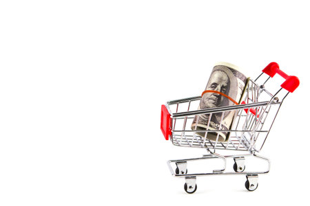 Shopping cart with dollarsの写真素材