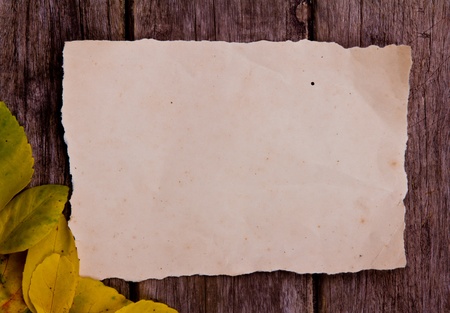 Old paper on brown woodの写真素材