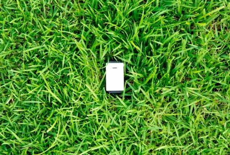 Green energy concept : outlet in grassの写真素材