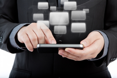 Business man use mobile phone with application iconsの写真素材