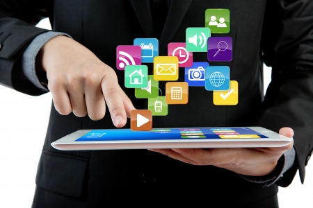 Business man use tablet pc computer with colorful applicationの写真素材