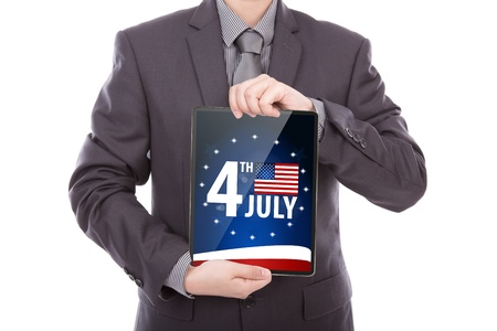 Business man with touch screen device  show American Flag for Independence Dayの写真素材