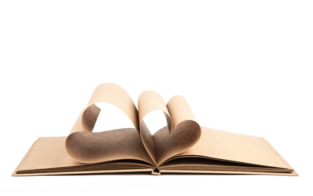 Book with opened pages of shape of heart isolated on white backgroundの写真素材