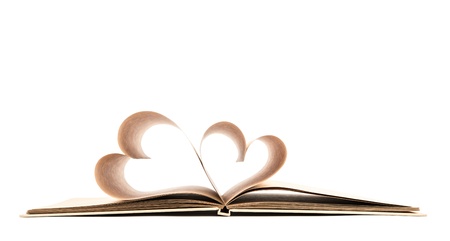 Book with opened pages of shape of heart isolated on white backgroundの写真素材