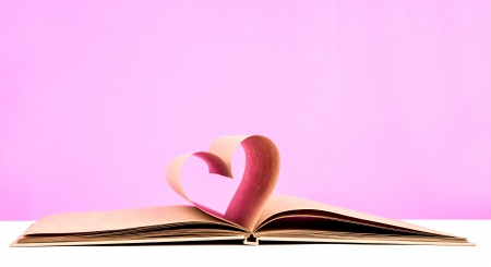 Book with opened pages of shape of heartの写真素材