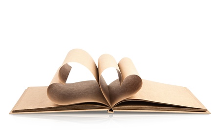 Book with opened pages of shape of heart isolated on white backgroundの写真素材