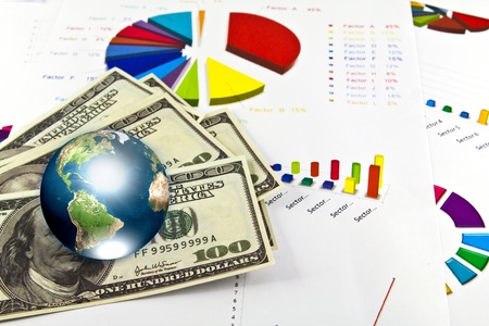 Pen and business graph with earth (Elements of this image furnished by NASA)の写真素材