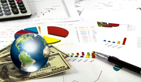 Pen and business graph with earth (Elements of this image furnished by NASA)の写真素材