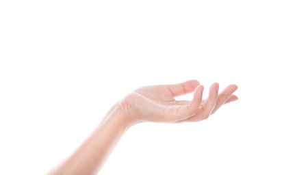 Beautiful woman's hand, palm up isolated on white backgroundの写真素材