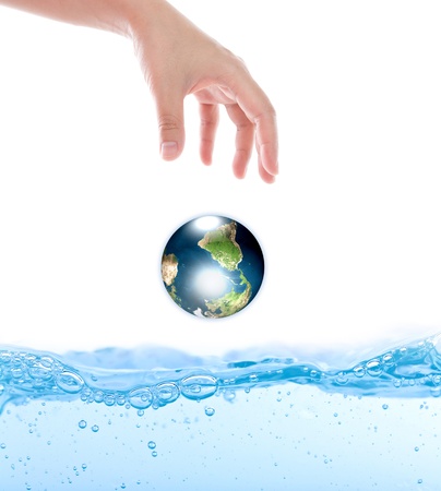 Earth drop from hand over waterの写真素材