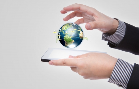 Business man using a touch screen device against white backgroundの写真素材