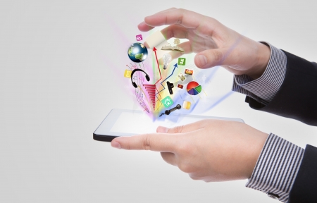 Business man using a touch screen device against white backgroundの写真素材