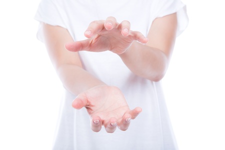Empty woman hands over body isolated on background.の写真素材