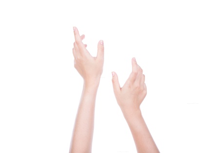 Two hands reaching and holding a concept isolated on white backgroundの写真素材
