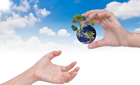 Eco concept : Hand Giving new earthの写真素材