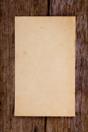 Old paper on brown woodの写真素材