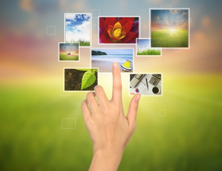 Hand touches the flow of imageの写真素材