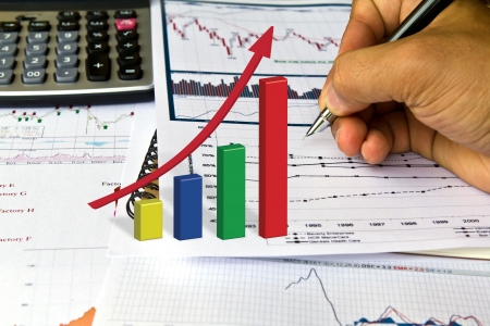 Hand write on Various financial charts on the table with calculatorの写真素材