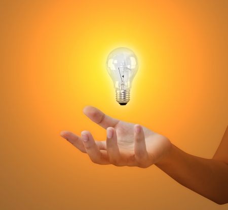Hand with Light bulbの写真素材