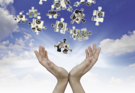 Hands and dollar money puzzleの写真素材