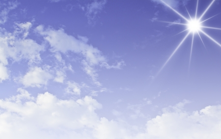 Blue sky with sun and beautiful cloudsの写真素材
