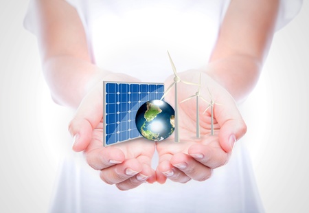 Woman hands hold Alternative Energy (solar cell, earth, wind turbine ) Elements of this image furnished by NASAの写真素材