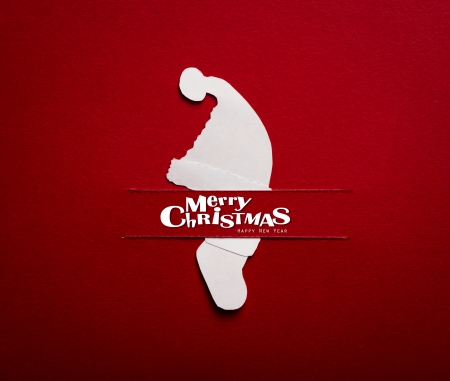 Vintage Christmas postcard with true paper cut of  santa hat and santa sockの写真素材