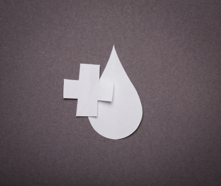 Medical background, Paper cut of blood drop and medical symbol with copy space for text or designの写真素材