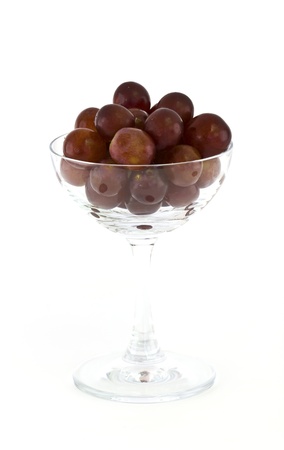 A bottle of red wine with glass and grapesの写真素材