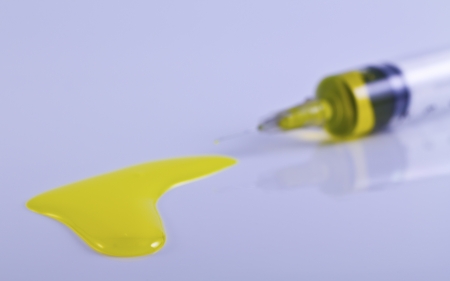 Medical syringe flow over of vaccineの写真素材