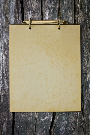 Grunge vintage old blank paper on wood wall.の写真素材