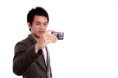 Young man with camera Isolated on white backgroundの写真素材