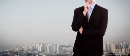 Businessman standing over a cityscapeの写真素材