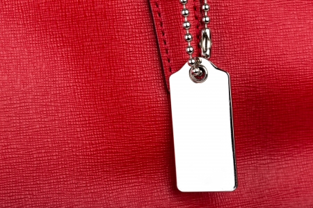 Red leather texture with metal tagの写真素材
