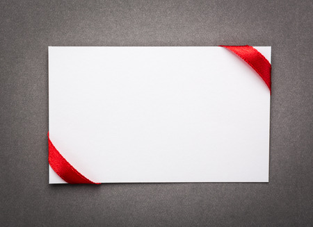 Card with red ribbons bowsの写真素材