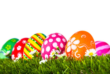 Easter Eggs with flower on Fresh Green Grass over white background