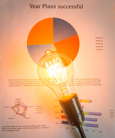 Light bulb with business graphの写真素材