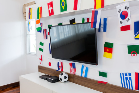 Modern room with TV and Flags for soccer championship 2014の写真素材