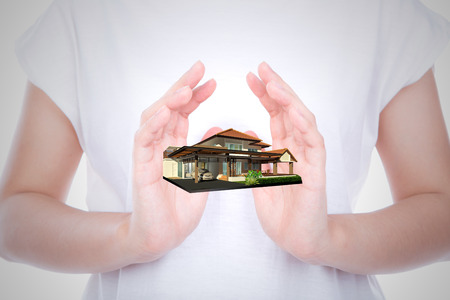 House on woman hands over body isolated on background.の写真素材