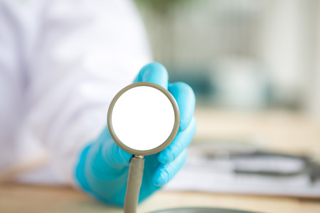 Doctor with stethoscope in the handsの写真素材
