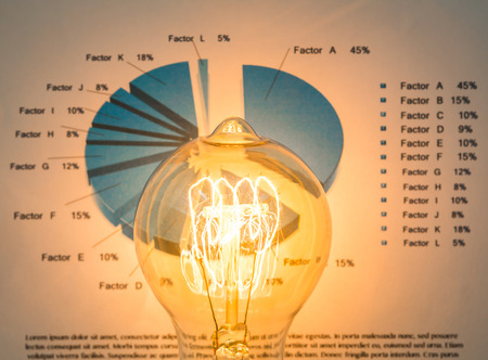 Light bulb with business graphの写真素材