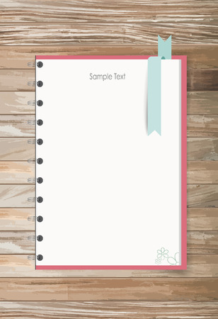 Note book on a wooden desk. のイラスト素材