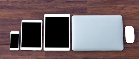 laptop with tablet and smart phone on table