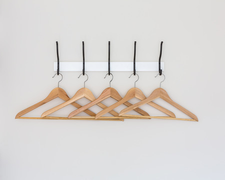 Wood coat hanger on wallの写真素材