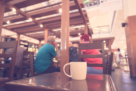 Coffee cup on table in cafe ( Filtered image processed vintage effect. )の写真素材